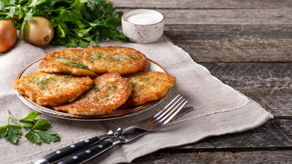 Wall Mural - Delicious potato pancakes on a plate. Copy space