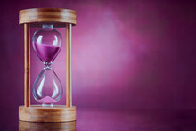 Pink Sand Hourglass On Pink Background