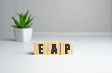 Employee assistance program EAP sign on wooden cubes