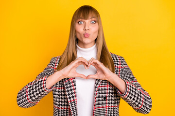 Canvas Print - Photo of adorable positive person arms fingers make heart shape kiss lips isolated on yellow color background