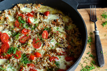 Kaszotto - Polish porridge with eggplant and oyster mushrooms in a pan