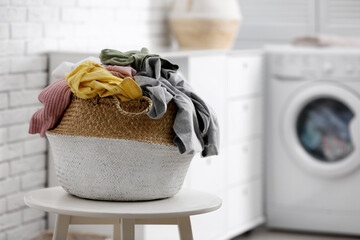 Poster - Wicker basket with dirty laundry indoors, space for text