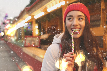 Wall Mural - Young woman spending time at Christmas fair, space for text