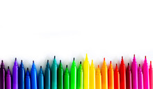 Felt-tip Pens On A White Background. Multi-colored Markers Are Beautifully Folded By The Color Of The Rainbow. Creativity And Design Concept.