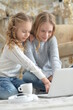 © aletia2011 - Girls using laptop at home on Christmas
