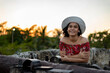 © Allen.G - Beautiful Colombian woman with colorful outfit in the old city of Cartagena, Colombia at a golden hour sunset