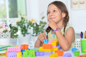 Canvas Print - happy cute little girl playing with cubes