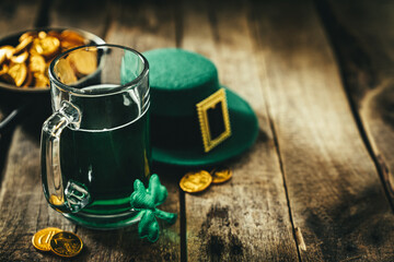st. patricks day concept - green beer and symbols, rustic background. part invitation.