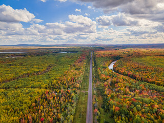 Canvas Print - Autumn aerial view of M64 Highway near Bonanza Falls on the Big Iron River -  Looking towards White Pine and Porcupine Mountains Wilderness State Park - Michigan Upper Peninsula  