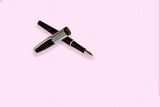Fototapeta  - Business fountain pen isolated on pink background.