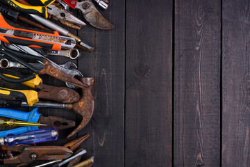 Hand tools and equipment are placed on the wooden floor with copy space for designing text - top view