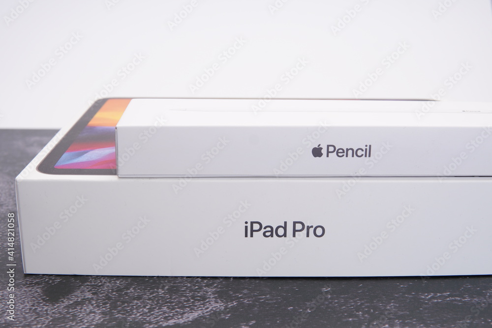 Apple iPad Pro 11 and Apple Pencil 2 unboxing on a grey Apple iPad Pro 11 and Apple Pencil 2 unboxing on a grey