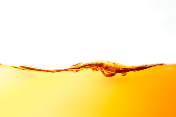 The surface of the orange water ripples looks like beer.