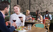 © JackF - Attractive girl with boyfriend enjoying dinner with wine in cozy restaurant