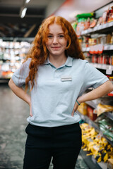 Wall Mural - Young worker at supermarket