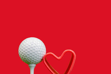 Wall Mural - Golf ball and red heart on red background