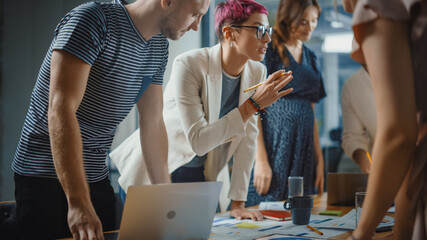 Wall Mural - Office Meeting in Conference Room: Beautiful Specialist with Short Pink Hair Talks about Firm Strategy with Diverse Team of Professional Businesspeople. Creative Start-up Team Discusses Big Project 