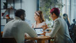 © Gorodenkoff - Diverse Multi-Ethnic Group of Professional Businesspeople Meeting in the Modern Office Conference Room. Creative Team Discuss App Design, Analyze Data, Plan Marketing Strategy, Disrupt Social Media