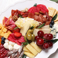 Wall Mural - Plate full of tasty assorted appetizers, closeup