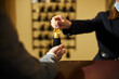 © Svitlana - Fragment photo of hotel guest receiving a key from room