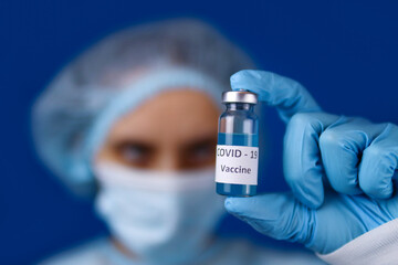 medical scientist holding Coronavirus COVID-19 DNA vaccine. Selective focus