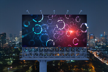 Information flow hologram on road billboard, night panorama city view of Bangkok. The largest technological center in Southeast Asia. The concept of programming science.
