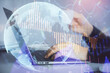 © peshkova - Double exposure of businesswoman hands typing on computer and forex graph hologram drawing. Financial analysis concept.