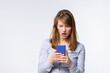 © Viorel - Angry young woman looking at smartphone frustrated by no signal or scam message, mad female disappointed by bad news reading on phone, upset girl get negative or rejection response on mobile