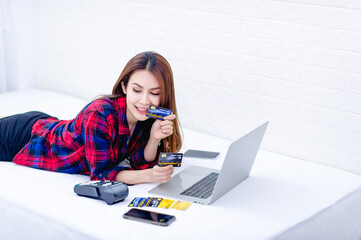 The woman and the computer in the white room Happy work The concept of happy working at home