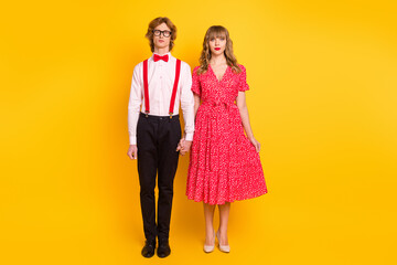 Sticker - Full length body size photo of couple keeping hands looking serious on date festive clothes isolated on bright yellow color background