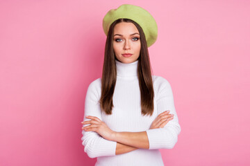 Portrait of attractive serious content straight-haired girl folded arms isolated over pink pastel color background