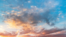 Natural Sky Background. Bright Sunset With Orange And Blue Clouds.