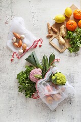 Wall Mural - Zero waste concept. Eco bags with fruits and vegetables. Eco-friendly shopping and cooking concept, flat lay