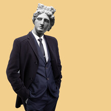Modern Art Collage. Concept Portrait Fashion Man In Coat. Gypsum Head Of Apollo.