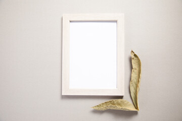 frame with leaves on table