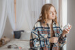 © mdyn - Woman Taking Medicine. Beautiful blond girl Holding white Bottle With Pills In Hand. Diet. Nutrition. Healthy Eating, Lifestyle. Headache concept, Mockup packaging