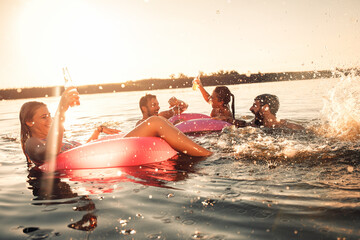 Friends enjoying a summer day swimming at the lake.