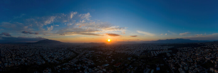 Wall Mural - Sunset over Athens, Greece. Aerial drone panoramic view from Penteli mount.