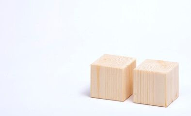 Two wooden cubes on a white background