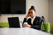 © Gerald R Carter Jr/Creative Flame - Young businesswoman sales consultant chatting in modern business office