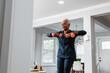 © Gerald R Carter Jr/Creative Flame - Senior Black woman exercising at home, active lifestyle fitness