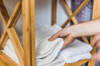 © Mar/Westend61 - Hand of woman picking up white towel from wooden rack