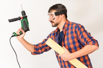 DIY enthusiast man holds a drill