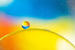© Javier De La Torre/ADDICTIVE STOCK - Closeup of abstract background with round shaped cells of vaccine of different sizes illuminated by colorful light