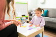 © AntonioDiaz - Preschool girl playing and talking with her child therapist