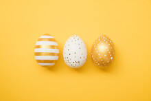 Easter Golden Decorated Eggs On Yellow Background. Minimal Easter Concept. Happy Easter Card With Copy Space For Text. Top View, Flatlay