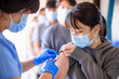 © Tom Wang - Doctor injecting vaccine for young people