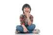 © lalalululala - Happy asian student sitting on white background isolated..