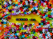 © Mohd Azrin - Selective focus.Colorful dice with word THANK YOU on yellow background.Shot were noise and film grain.