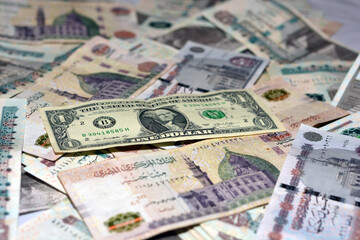 Egypt national currency with USA dollar banknote backdrop. Money banknotes. Egyptian pounds banknotes background. Egyptian pounds money and American dollars exchange rate 